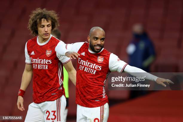 Alexandre Lacazette of Arsenal celebrates with David Luiz after scoring their side's second goal from the penalty spot during the Premier League...