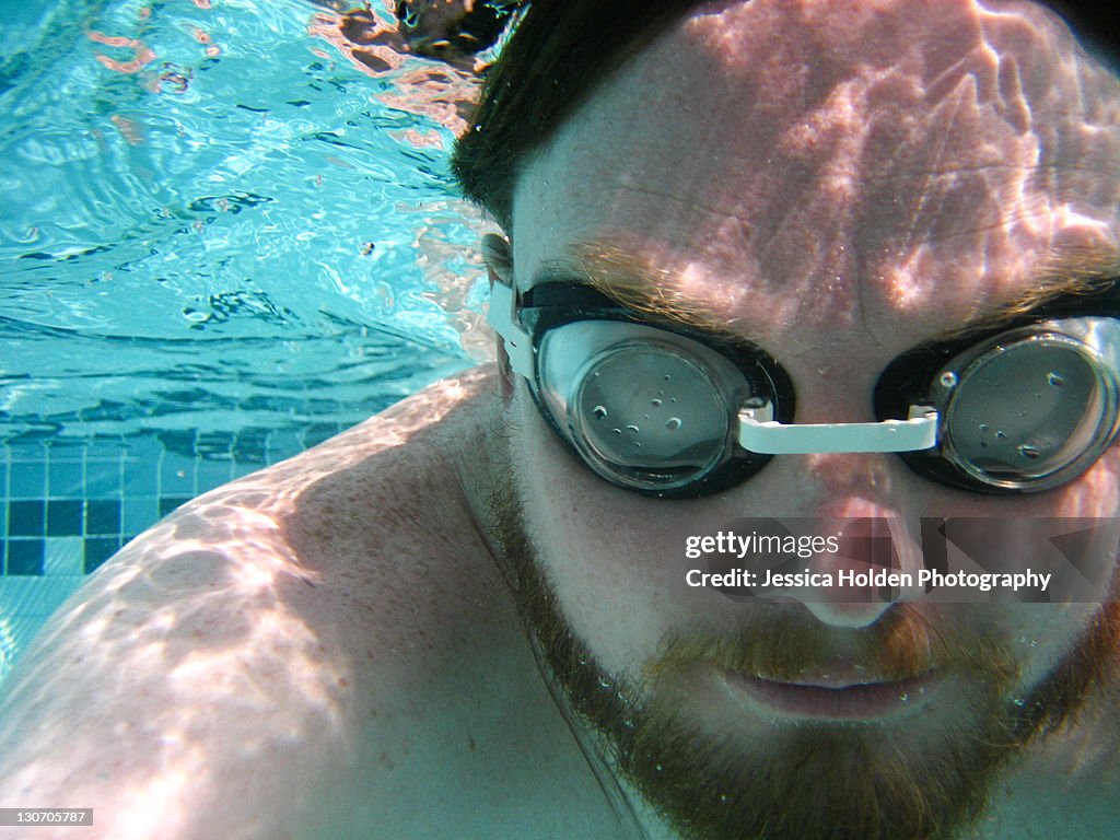 Man submerged underwater