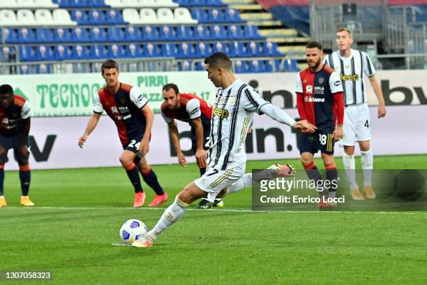 Cristiano Ronaldo of Juventus scores his goal during the Serie A match between Cagliari Calcio and Juventus at Sardegna Arena on March 14, 2021 in...
