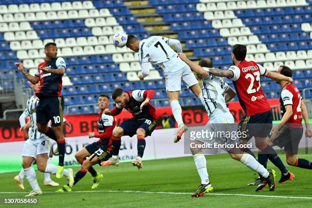 Cristiano Ronaldo of Juventus scores his goal during the Serie A match between Cagliari Calcio and Juventus at Sardegna Arena on March 14, 2021 in...