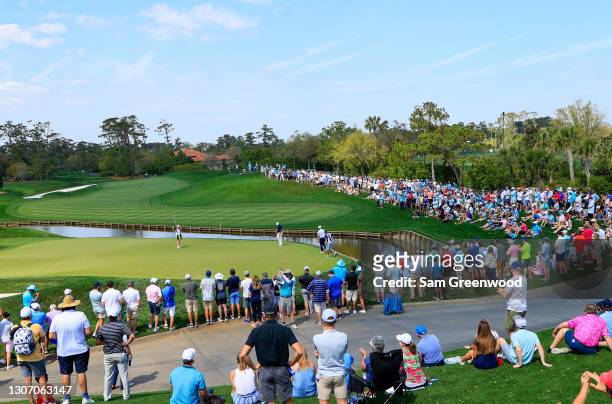 Fans surround the fourth green during the final round of THE PLAYERS Championship on THE PLAYERS Stadium Course at TPC Sawgrass on March 14, 2021 in...