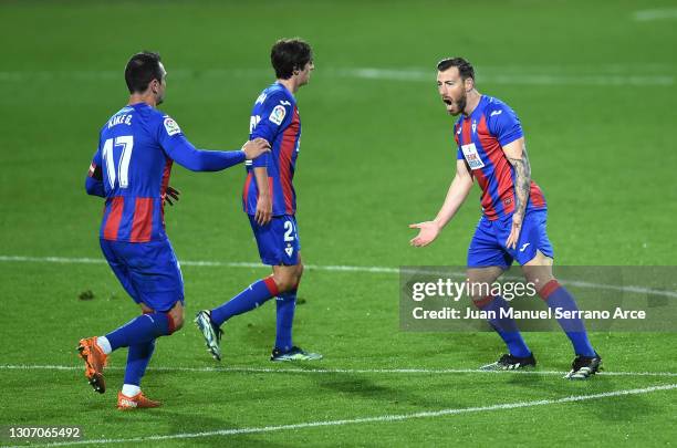 Sergi Enrich of SD Eibar celebrates with team mates after scoring their side's first goal during the La Liga Santander match between SD Eibar and...