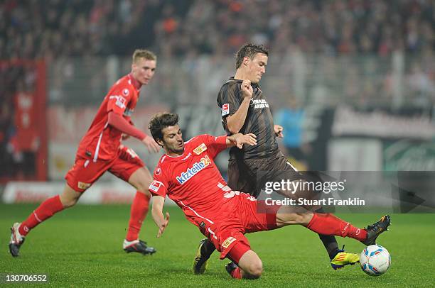 Max Kruse of St. Pauli is challenged by Markus Karl of Berlin during the Second Bundesliga match between 1. FC Union Berlin and FC St. Pauli at...