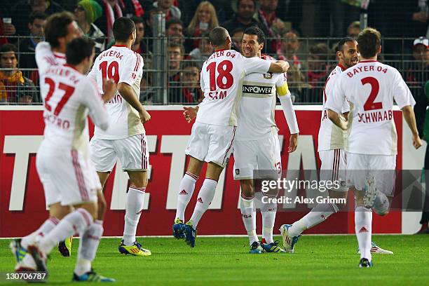 Michael Ballack of Leverkusen celebrates his team's first goal with team mate Sidney Sam during the Bundesliga match between SC Freiburg and Bayer 04...