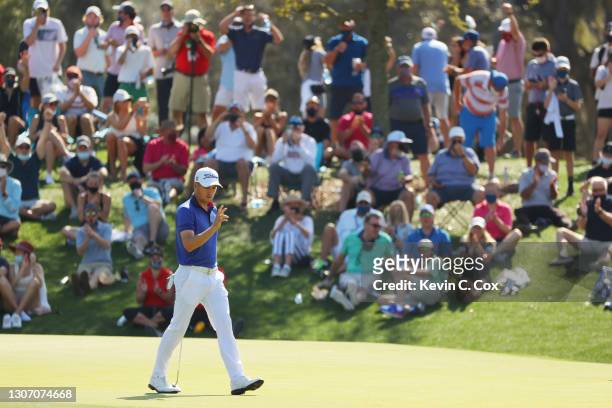 Justin Thomas of the United States reacts to his eagle putt on the 11th green during the final round of THE PLAYERS Championship on THE PLAYERS...