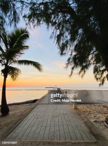 sunset at rum point, grand cayman - grand cayman islands foto e immagini stock