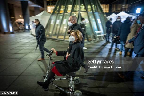 Malu Dreyer, premier of Rhineland-Palatinate and member of the German Social Democrats drives a electric scooter while and her husband Klaus Jensen...