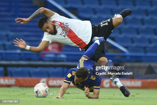 Paulo Díaz of River Plate makes a foul to Nicolás Capaldo of Boca Juniors after which referee sanctions a penalty during a match between Boca Juniors...