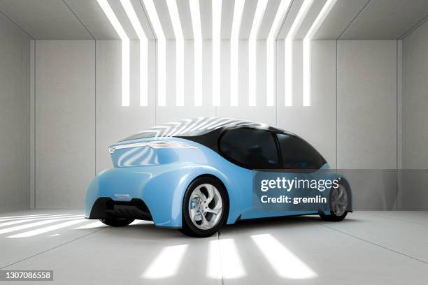 generisches modernes autonomes auto in betongarage - driverless cars stock-fotos und bilder