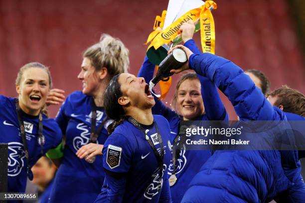 Sam Kerr of Chelsea celebrates by having champagne poured into her mouth after her teams victory during the FA Women's Continental Tyres League Cup...