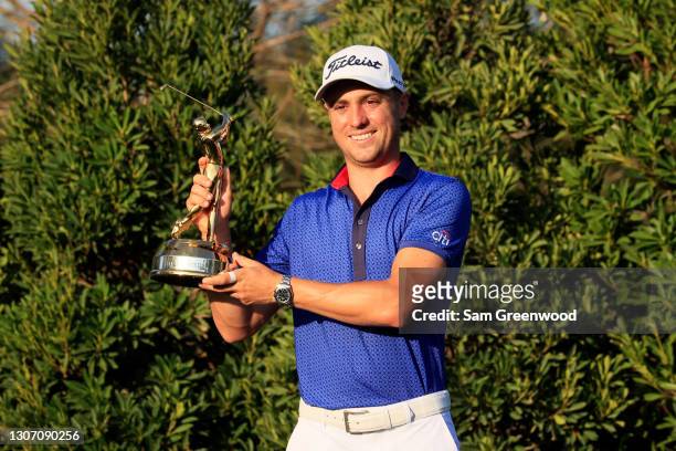Justin Thomas of the United States celebrates with the trophy after winning during the final round of THE PLAYERS Championship on THE PLAYERS Stadium...