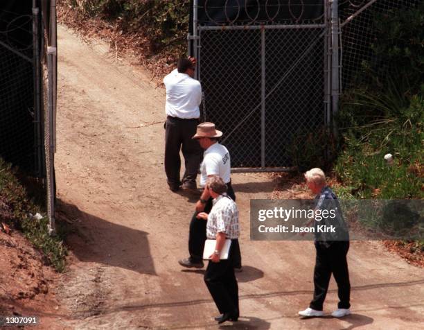 Men adjust gates at the site of Jennifer Aniston and Brad Pitt''s wedding July 27, 2000 in Malbu, CA. It was reported that they will be married this...
