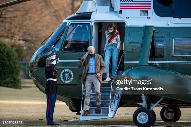 President Joe Biden and Natalie Biden exit Marine One on the South Lawn of the White House on March 14, 2021 in Washington, DC. President Biden and...