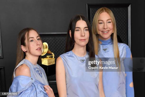 Alana Haim, Danielle Haim and Este Haim of HAIM attend the 63rd Annual GRAMMY Awards at Los Angeles Convention Center on March 14, 2021 in Los...