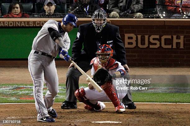 Josh Hamilton of the Texas Rangers hits a two-run home run in the 10th inning off of Jason Motte of the St. Louis Cardinals during Game Six of the...
