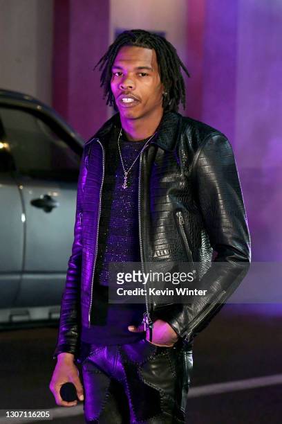 In this image released on March 14th, Lil Baby performs at the 63rd Annual GRAMMY Awards broadcast on March 14th, 2021.