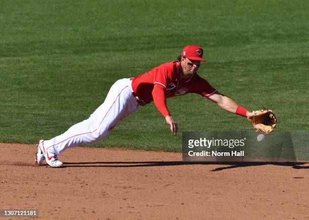 Kyle Farmer of the Cincinnati Reds cannot make a diving stop on a single hit by Ivan Castillo of the San Diego Padres during the sixth inning of a...