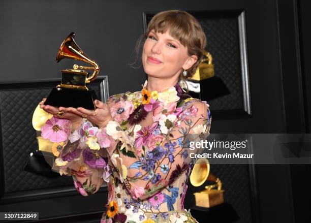 Taylor Swift, winner of Album of the Year for 'Folklore', poses in the media room during the 63rd Annual GRAMMY Awards at Los Angeles Convention...
