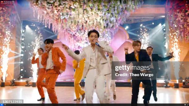 In this screengrab released on March 14, Jin, J-Hope, Suga, Jungkook, V, Jimin, and RM of BTS perform onstage during the 63rd Annual GRAMMY Awards...