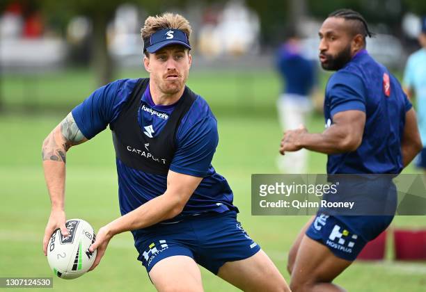 Cameron Munster of the Storm passes the ball during a Melbourne Storm NRL training session at Gosch's Paddock on March 15, 2021 in Melbourne,...