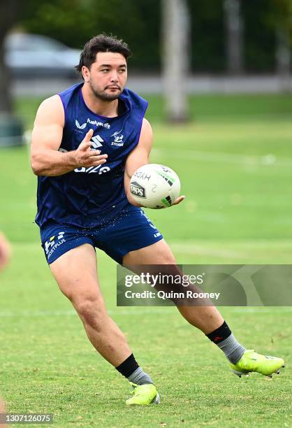 Brandon Smith of the Storm passes the ball during a Melbourne Storm NRL training session at Gosch's Paddock on March 15, 2021 in Melbourne, Australia.