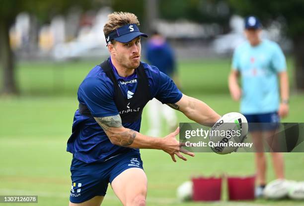 Cameron Munster of the Storm passes the ball during a Melbourne Storm NRL training session at Gosch's Paddock on March 15, 2021 in Melbourne,...