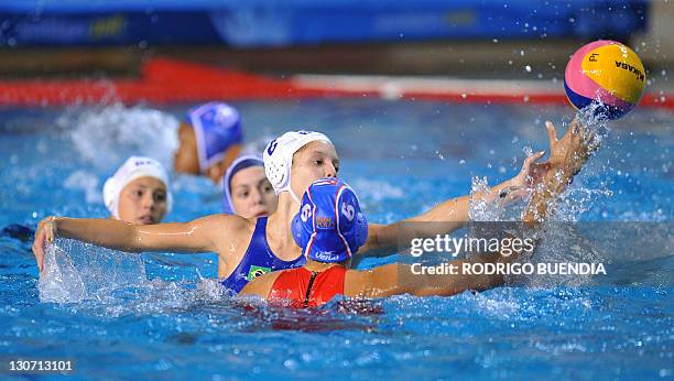 Brazil's Izabella Chiappini vies for the ball with Cuba's Mayeli Bernal during a Guadalajara 2011 XVI Pan American Games water polo match in...