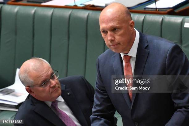 Prime Minister Scott Morrison and Minister for Home Affairs Peter Dutton look on during Question Time in the House of Representatives at Parliament...