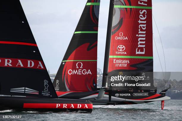 Emirates Team New Zealand back on it's foils sails past a marooned Prada Luna Rossa during the America's Cup Race between Emirates Team New Zealand...