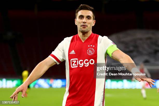Dusan Tadic of Ajax celebrates scoring his teams second goal of the game during the UEFA Europa League Round of 16 First Leg match between Ajax and...