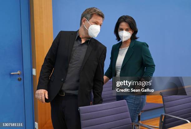 Annalena Baerbock and Robert Habeck, co-leaders of the German Greens party, depart after speaking to the media the day after elections in the states...