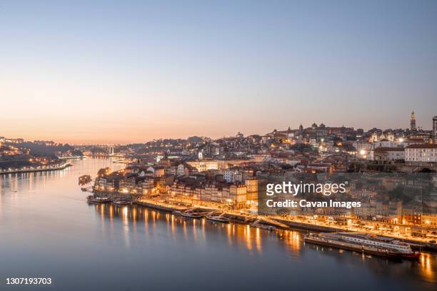 view of the unesco porto site at sunset with city light on, overlookin - real time stock pictures, royalty-free photos & images