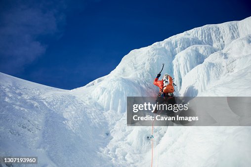 Male Ice climbing guide leading an ice climb in New Hampshire Male Ice climbing guide leading an ice climb in New Hampshire