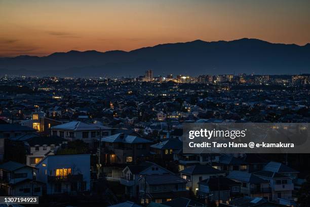 illuminated residential district in kanagawa prefecture of japan - mountain range night stock pictures, royalty-free photos & images