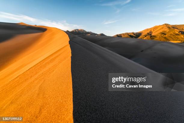 last sunlight hits the sand dunes, colorado - great sand dunes national park stock pictures, royalty-free photos & images