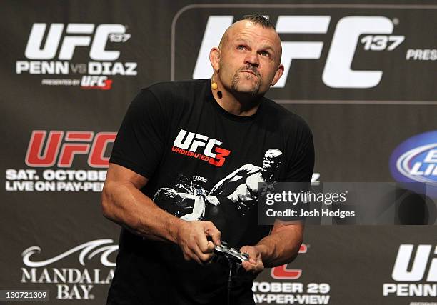 Former UFC champion Chuck Liddell plays the UFC Undisputed 3 video game on stage before the UFC 137 weigh-in at the Mandalay Bay Events Center on...