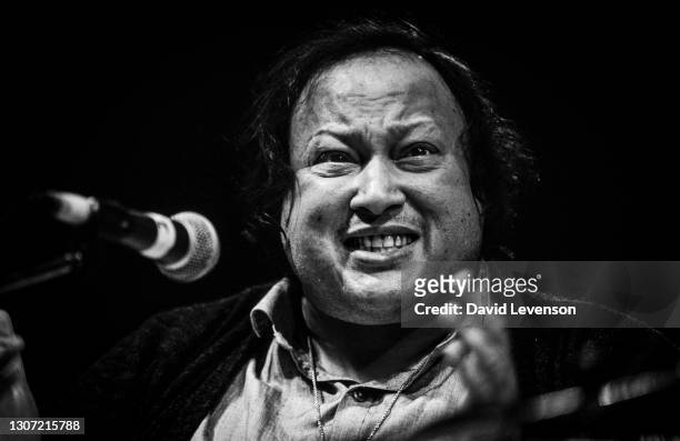 Nusrat Fateh Ali Khan, at the WOMAD festival in Reading, UK, on July 17, 1993. He was a Pakistani vocalist, musician and music director primarily a...