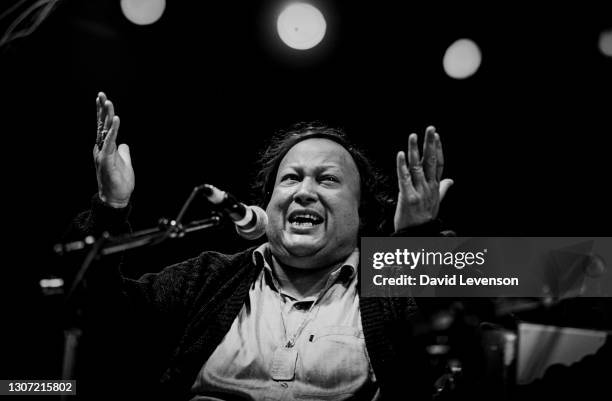 Nusrat Fateh Ali Khan, at the WOMAD festival in Reading, UK, on July 17, 1993. He was a Pakistani vocalist, musician and music director primarily a...