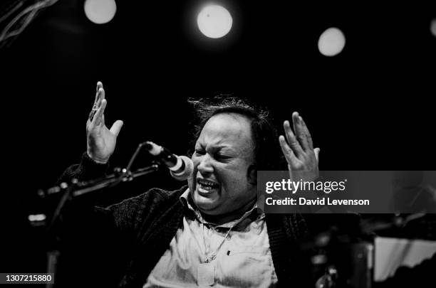 Nusrat Fateh Ali Khan, at the WOMAD festival in Reading, UK, on July 17, 1993. He was a Pakistani vocalist, musician and music director primarily a...