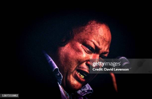 Nusrat Fateh Ali Khan, at the WOMAD festival in Reading, UK, on July 17, 1993. He was a Pakistani vocalist, musician and music director primarily a...