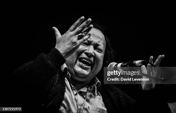 Nusrat Fateh Ali Khan, at the WOMAD festival in Reading, UK, on July 17, 1993. He was a Pakistani vocalist, musician and music director primarily a...