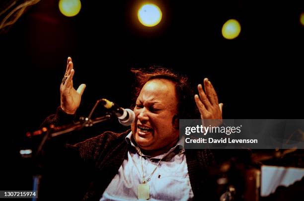 Nusrat Fateh Ali Khan, at the WOMAD festival in Reading, UK, on July 17, 1993. He was a Pakistani vocalist, musician and music director primarily a...