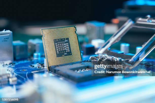 the cpu laying on the table with the computer hardware components - mother board stock pictures, royalty-free photos & images