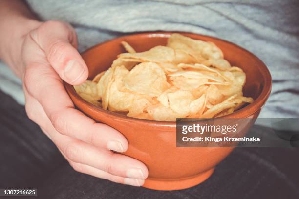 bowl of potato chips - potato chips stock pictures, royalty-free photos & images
