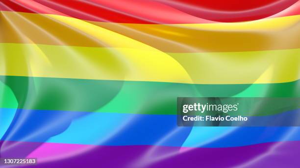 rainbow flag flapping on a sunny day filling the frame - gay pride flag stock pictures, royalty-free photos & images