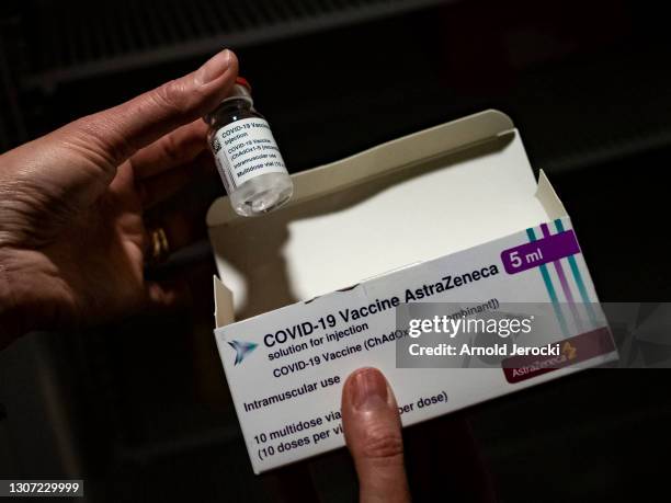 Member of medical staff shows the Oxford-AstraZeneca vaccine at the vaccinodrome set up in the Velodrome stadium on March 15, 2021 in Marseille,...
