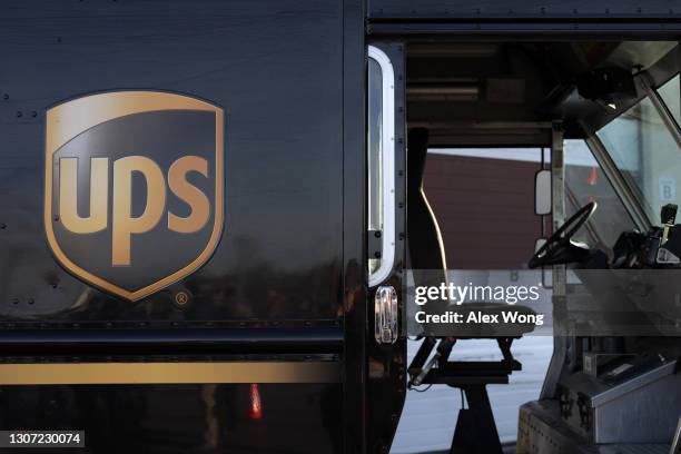 United Parcel Service hybrid electric truck is seen ourside a UPS facility that is delivering vaccines to Washington, DC, and Maryland areas March...