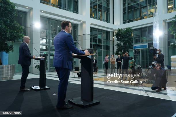 German Health Minister Jens Spahn speaks to the media to announce that Germany is temporarily suspending inoculations against COVID-19 with the...