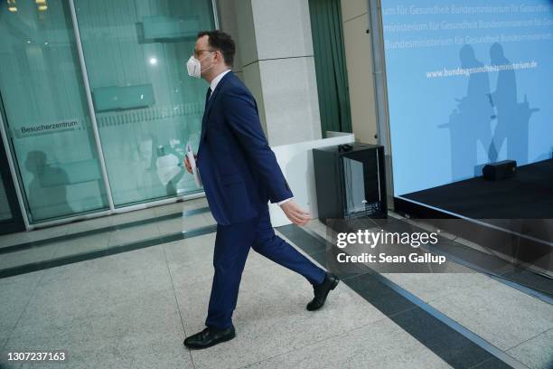 German Health Minister Jens Spahn departs after speaking to the media to announce that Germany is temporarily suspending inoculations against...