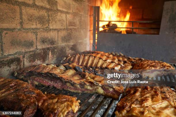 argentinian style grilled meat - asado stock-fotos und bilder